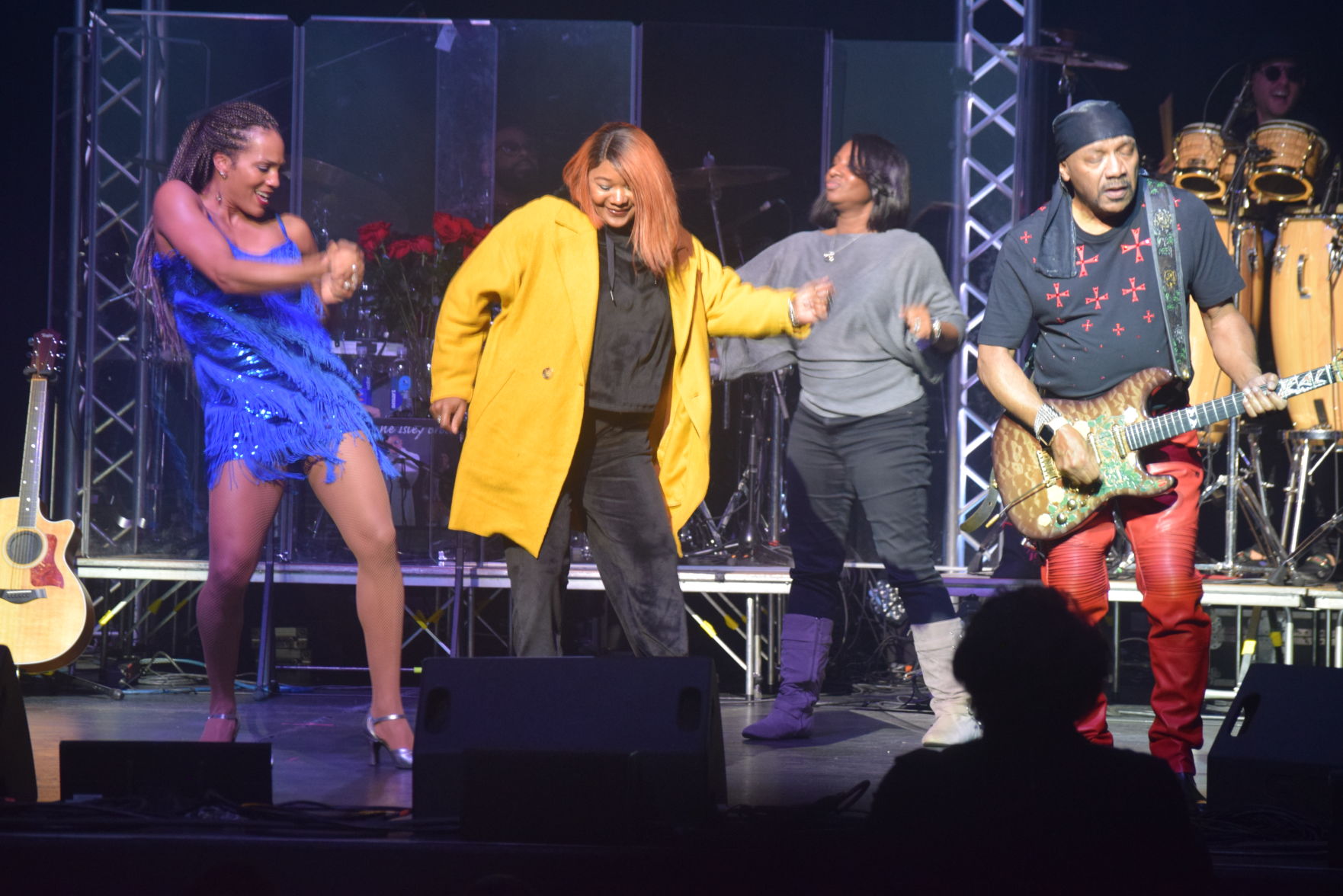 Dancers & Women are on stage and Ernie Plays his guitar.